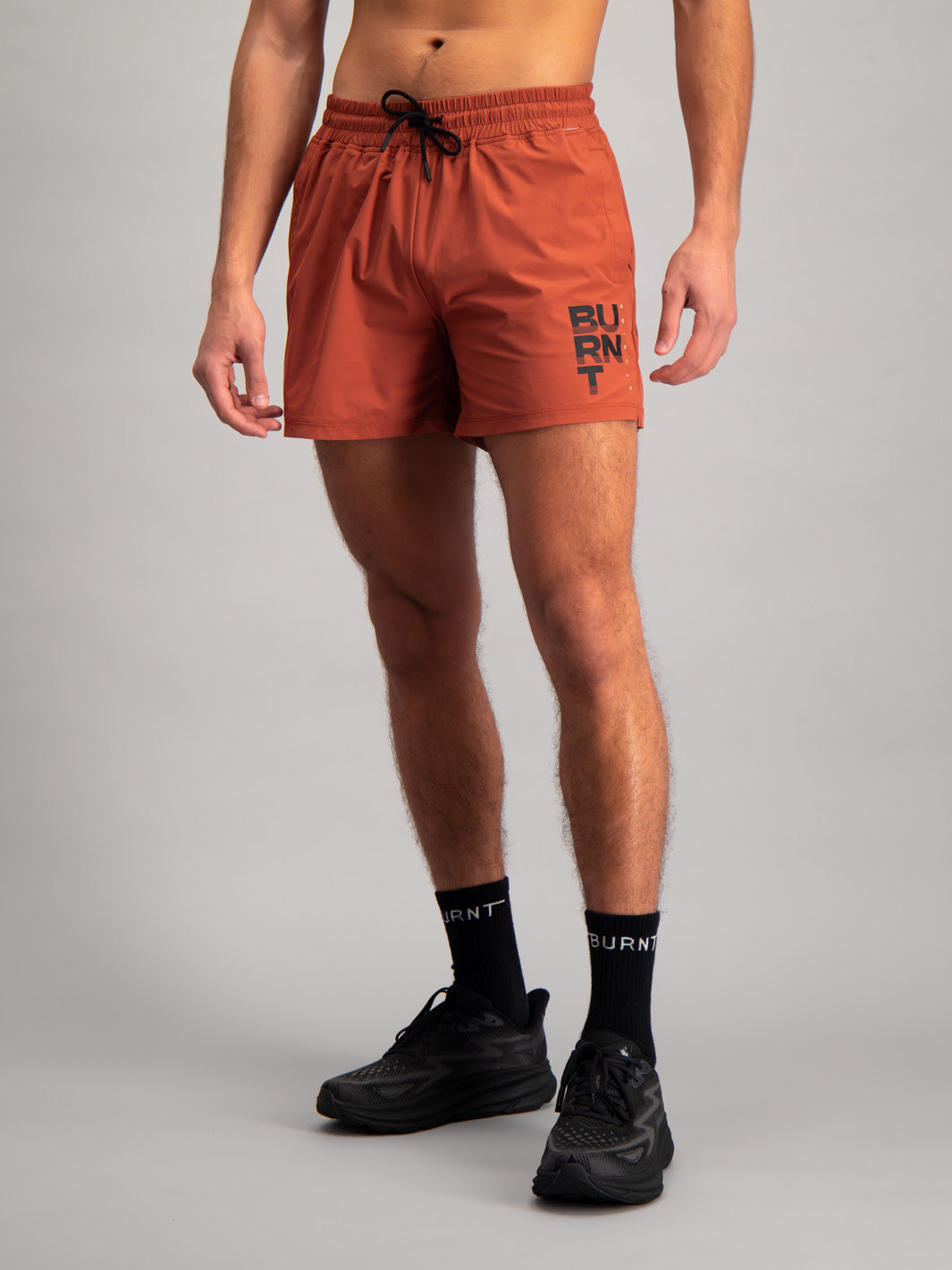 Burnt Studios Activewear 5-inch shorts in core rust front