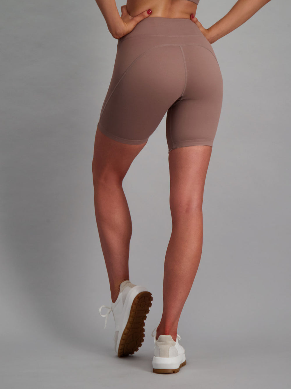 Latte colour activewear shorts with no-ride feature. 