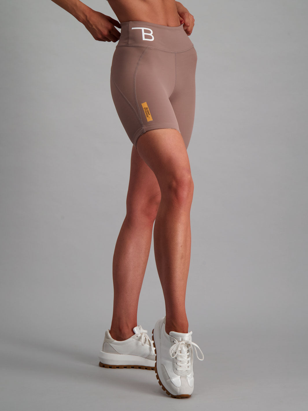 Latte colour activewear shorts with no-ride feature. 